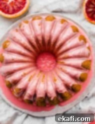 Vibrant Blood Orange Bundt Cake 11 Overhead photo of a pink blood orange glazed bundt cake.
