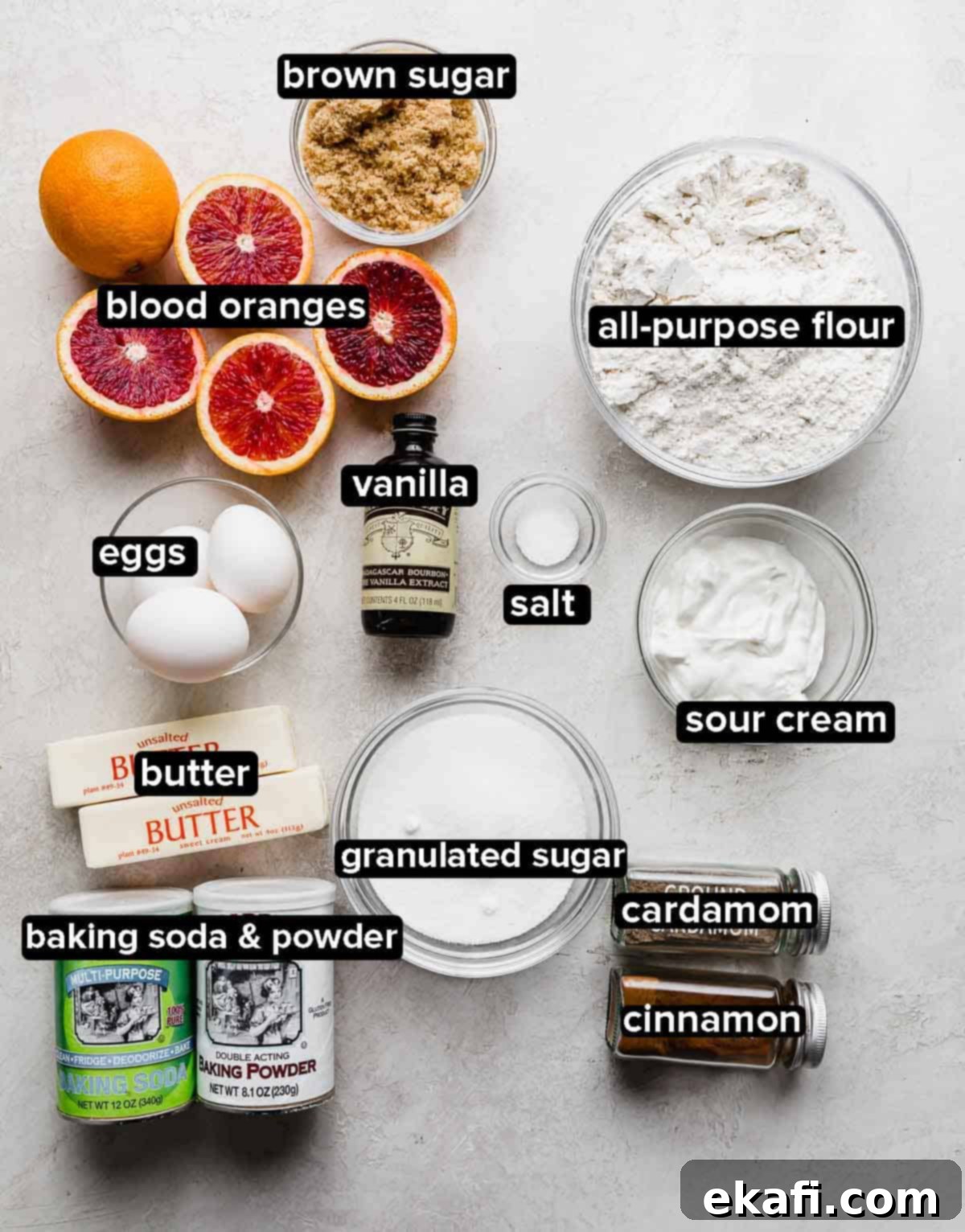 Vibrant Blood Orange Bundt Cake 3 Blood Orange Bundt Cake ingredients portioned into glass bowls on a light gray background.