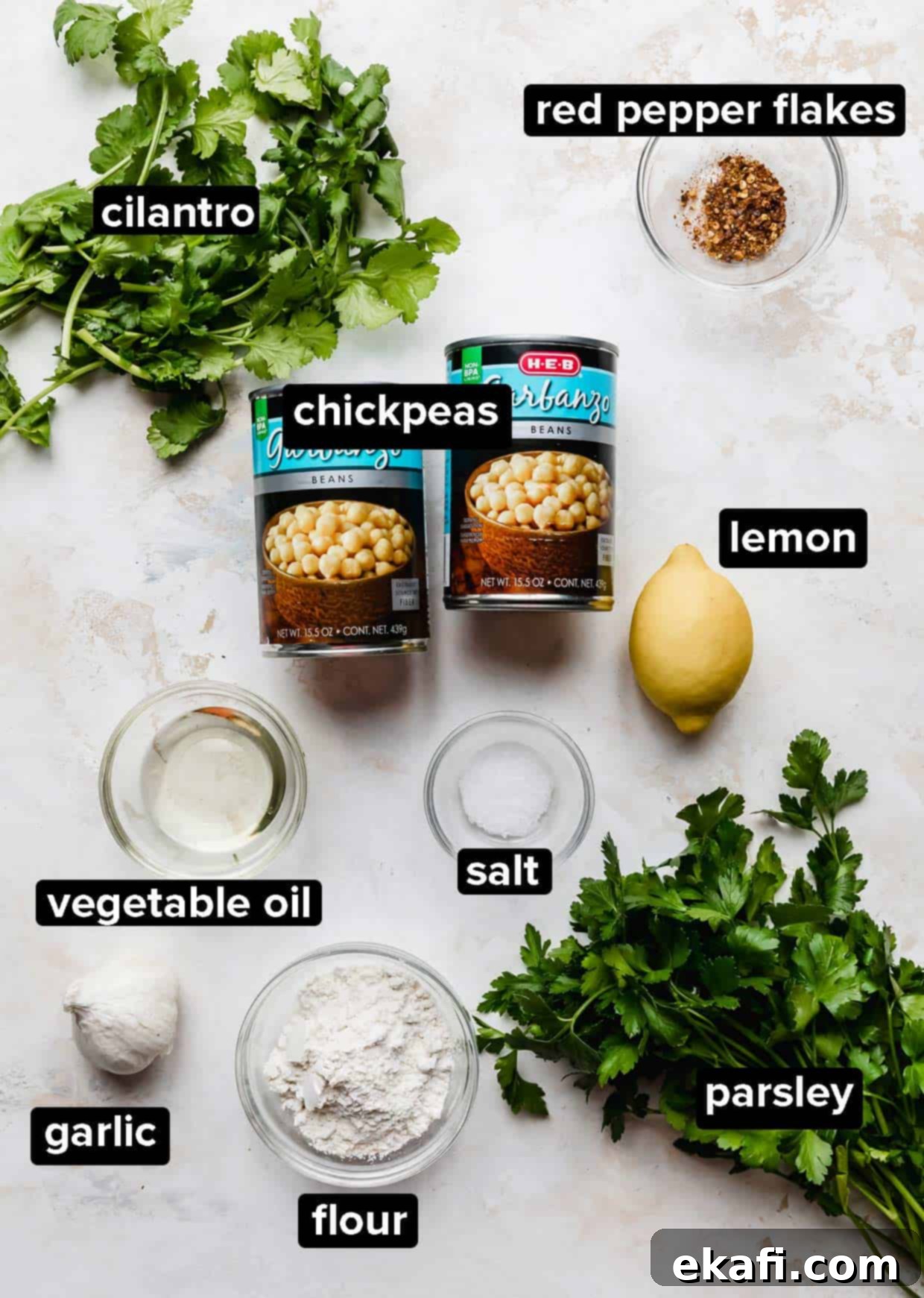 Fresh Herb Falafel 3 Baked Falafel ingredients on a white textured background.