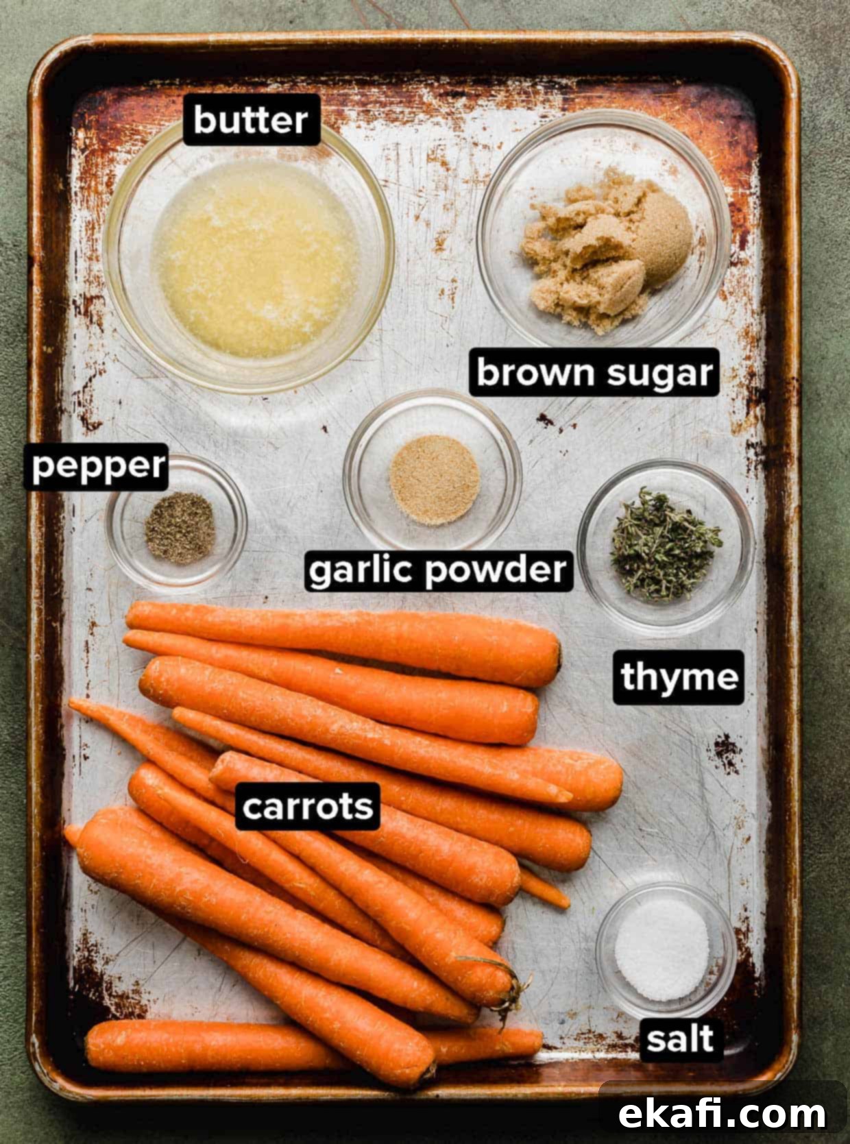 Καραμελωμένα Καρότα Καστανής Ζάχαρης 3 Brown Sugar Roasted Carrots ingredients on a baking sheet.