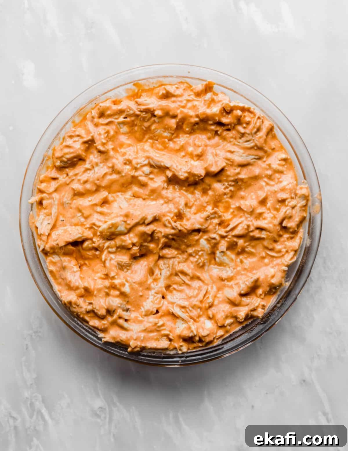 Ultimate Buffalo Chicken Dip 6 Buffalo Chicken Dip mixture in a glass pie dish.