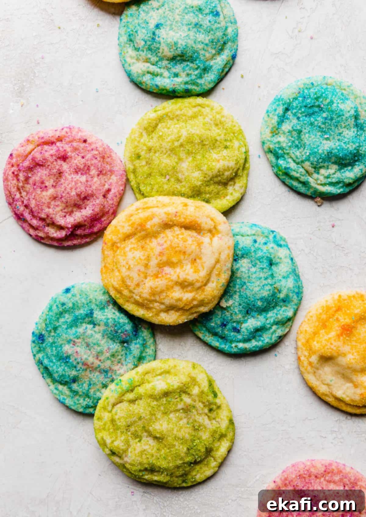 Sugared Delights 2 Vibrant, colorful sugar coated cookies arranged on a light grey background, showcasing various pastel shades.