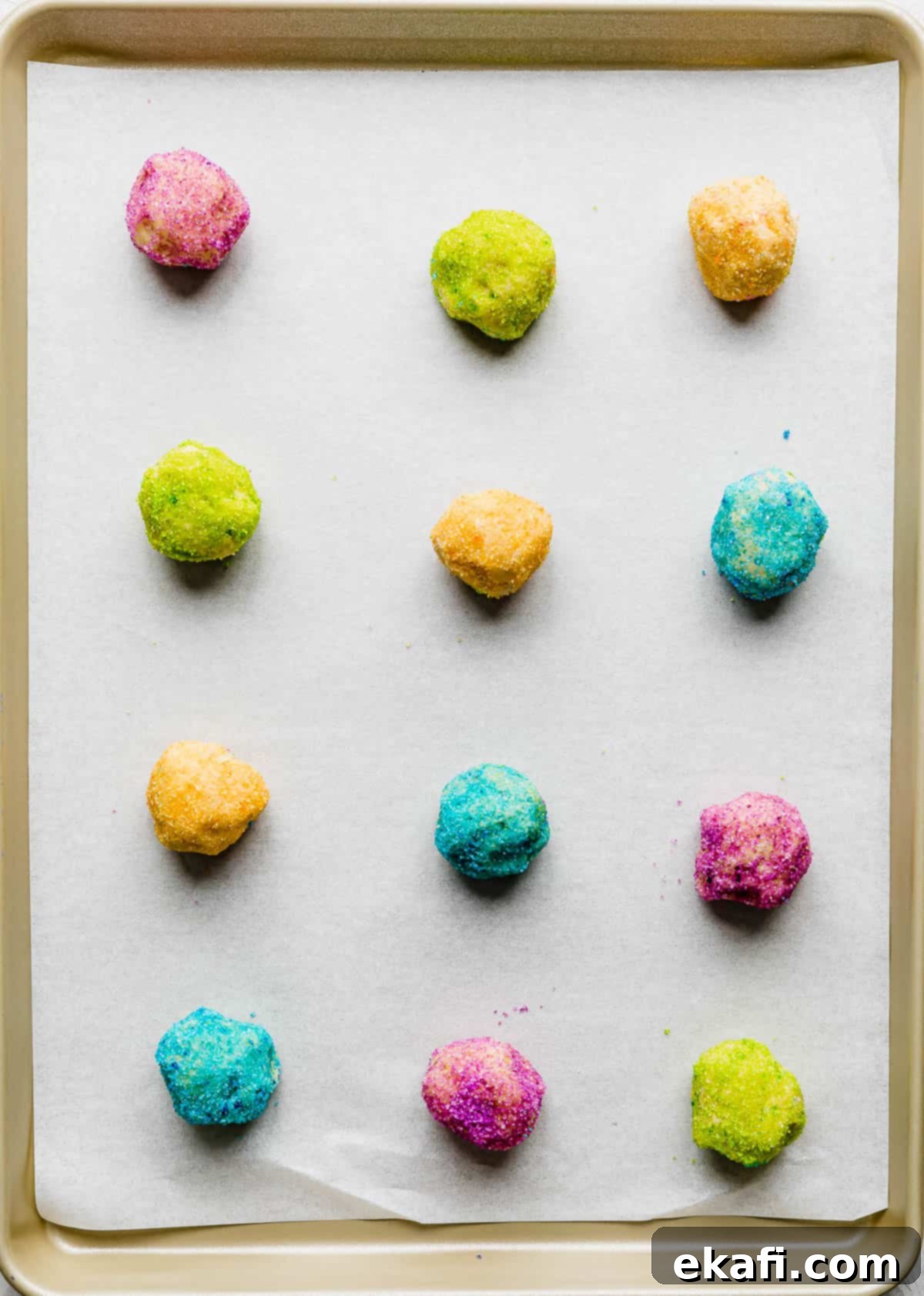 Sugared Delights 6 Close-up of sugar cookie dough balls covered in vibrant colored sugar or fine sprinkles, ready for baking.