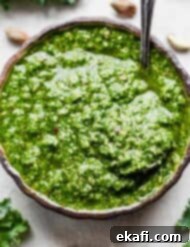 Easy Kale Pesto 7 A bright green Kale Pesto made with pistachios and kale in a bowl.