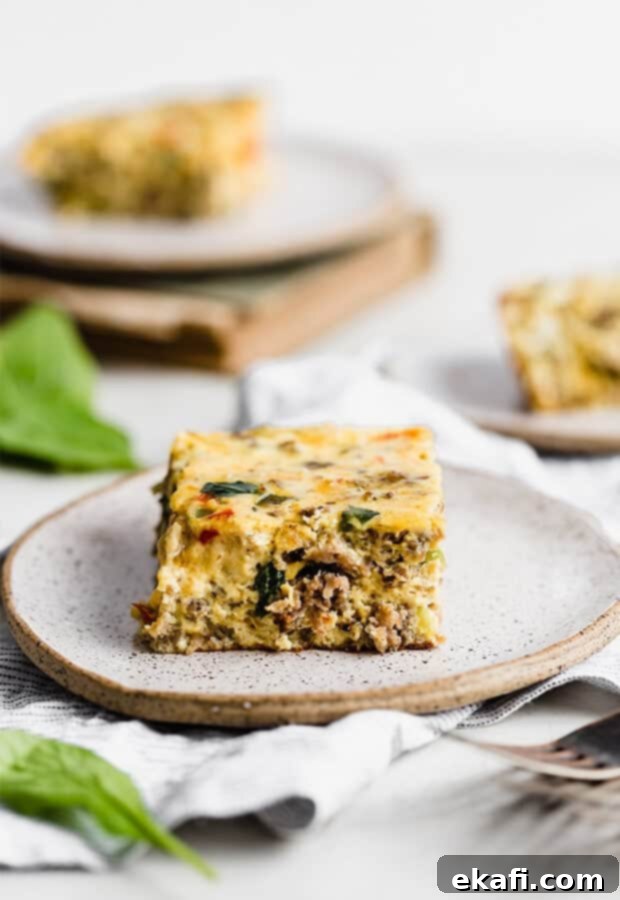 Effortless Breakfast Casserole 9 A perfectly portioned slice of Breakfast Casserole served on a white plate, highlighting its rich texture and ingredients.