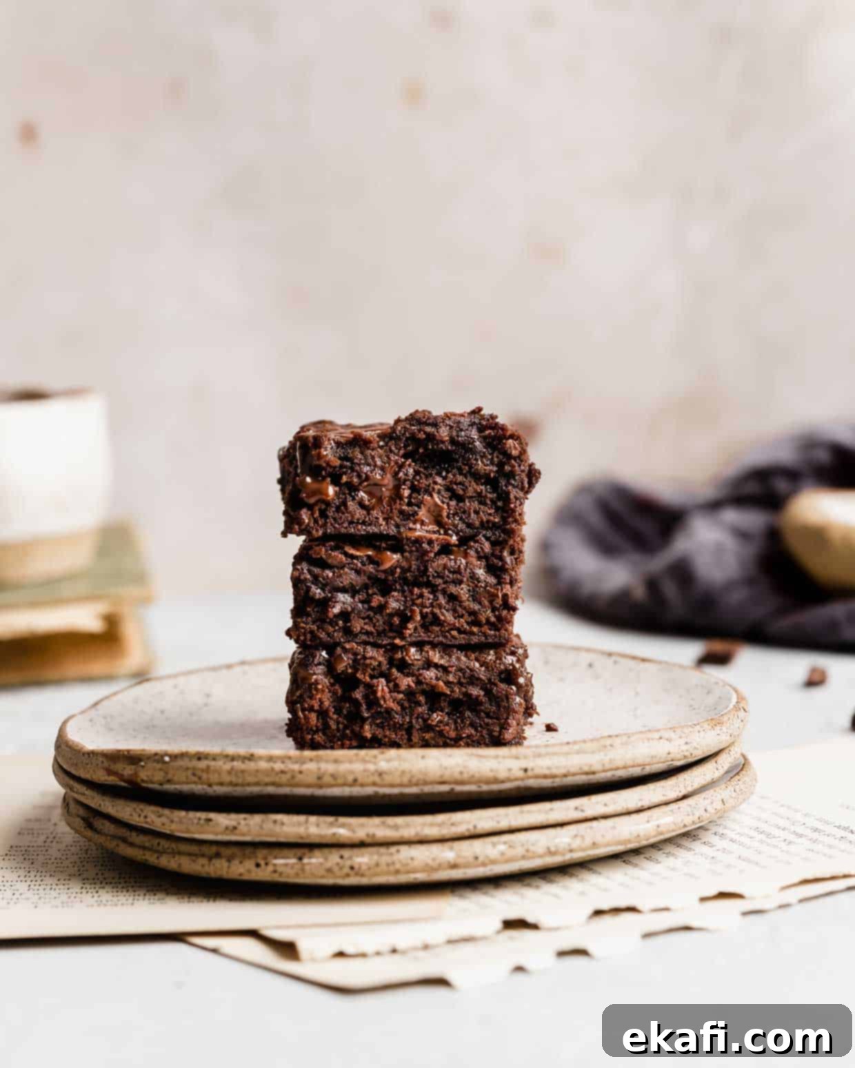Fudgy Homemade Brownies 7 Three Homemade Brownies stacked on a plate.