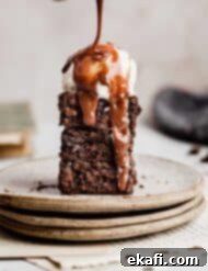 Fudgy Homemade Brownies 8 Hot fudge drizzling overtop vanilla ice cream topped Homemade Brownies.