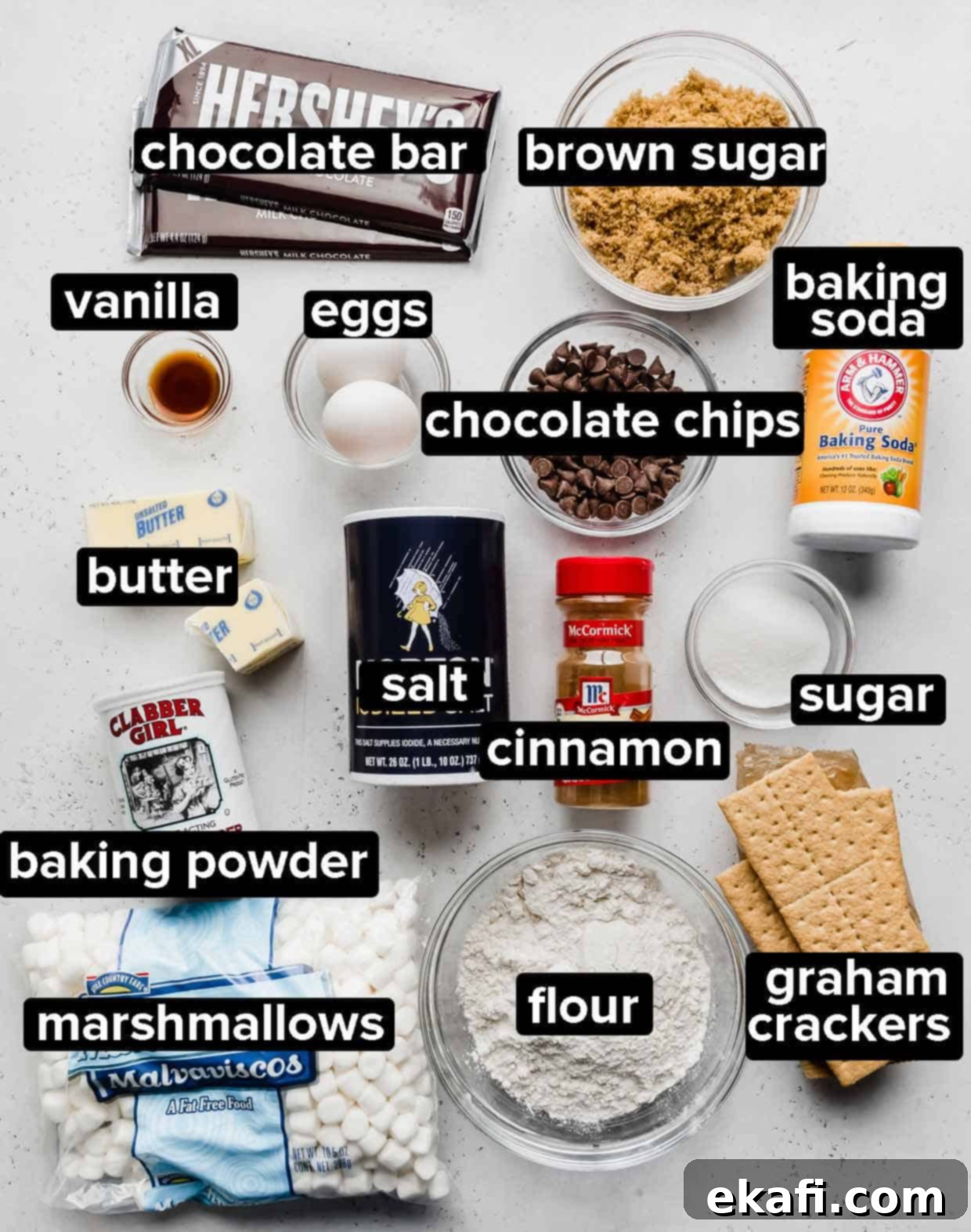 Smores Cookies 4 A flat lay photograph showcasing all the ingredients required to make S'mores cookies, neatly arranged on a white background.