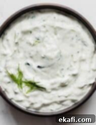 Authentic Tzatziki Recipe 6 Tzatziki Recipe in a black bowl on a white background.