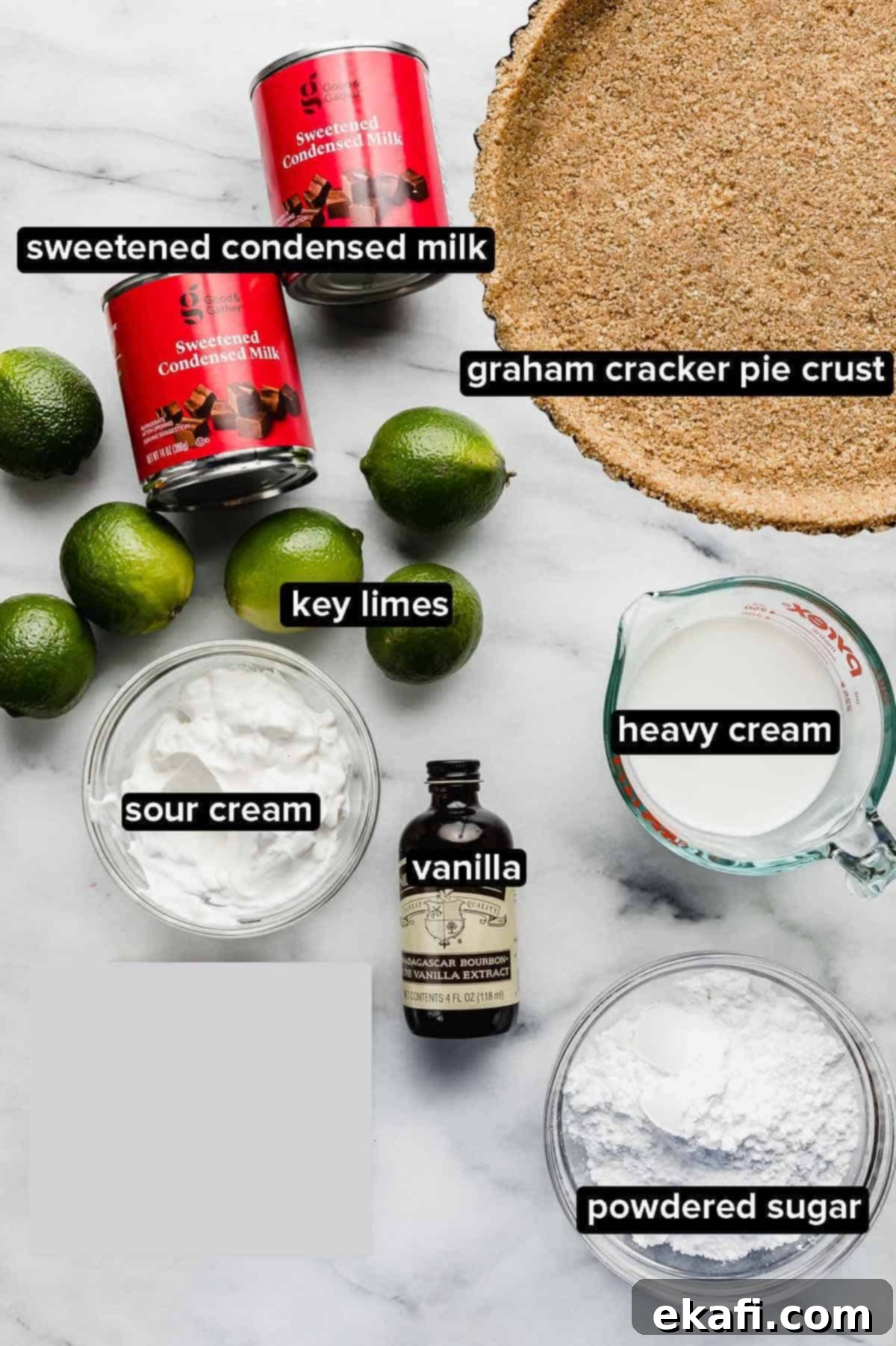 Velvety Key Lime Indulgence 3 A flat lay image displaying all the key ingredients for making Key Lime Pie with sour cream: fresh Key limes, bottle of Key lime juice, sweetened condensed milk, and a tub of sour cream.