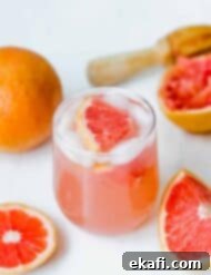 Italian Grapefruit Fizz 6 A vibrant Grapefruit Italian Soda with a grapefruit wedge as garnish, perfectly capturing its refreshing essence.