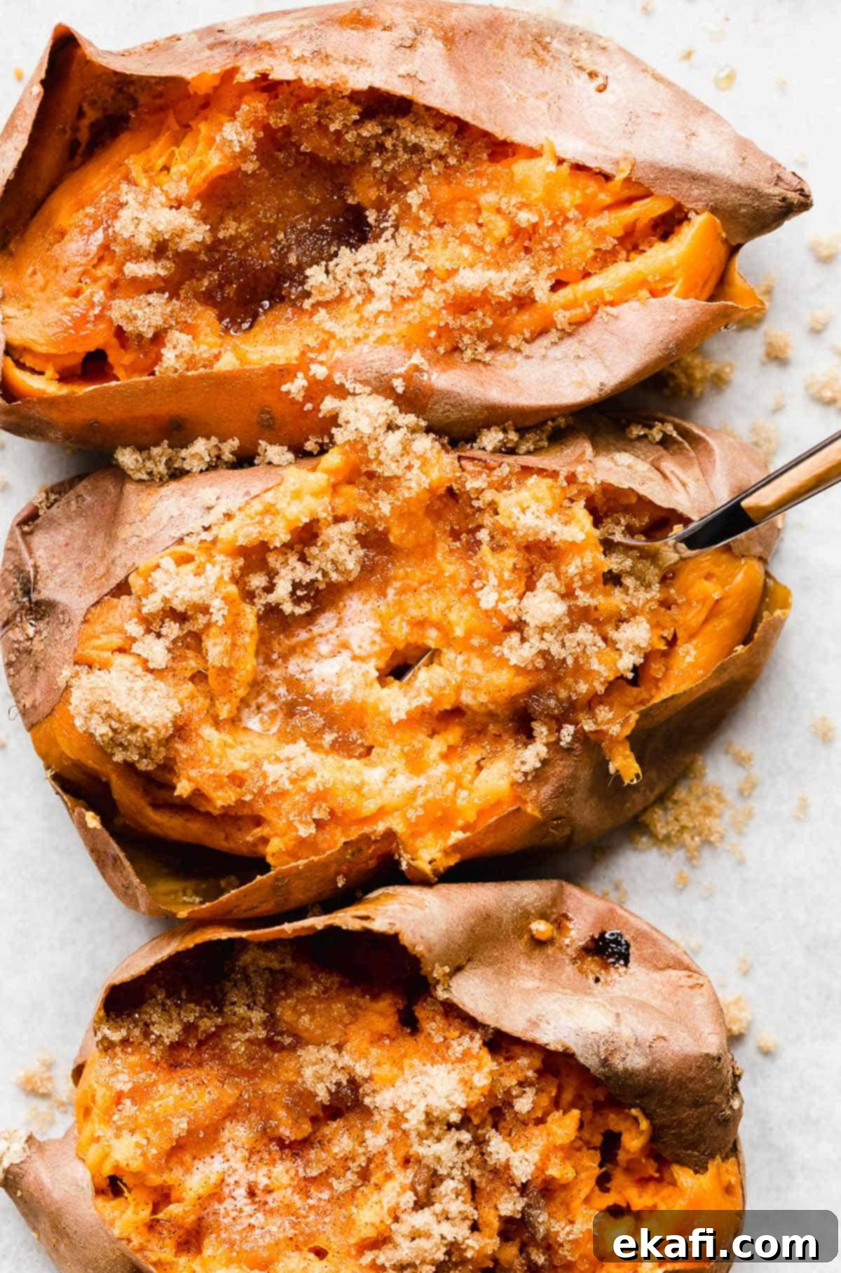 Easy Baked Sweet Potato 7 Baked Sweet Potato topped with brown sugar and butter.