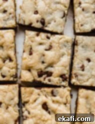 Decadent Chocolate Chip Cookie Bars 12 An overhead photo of delicious Chocolate Chip Cookie Bars, cut into perfect squares in a pan.