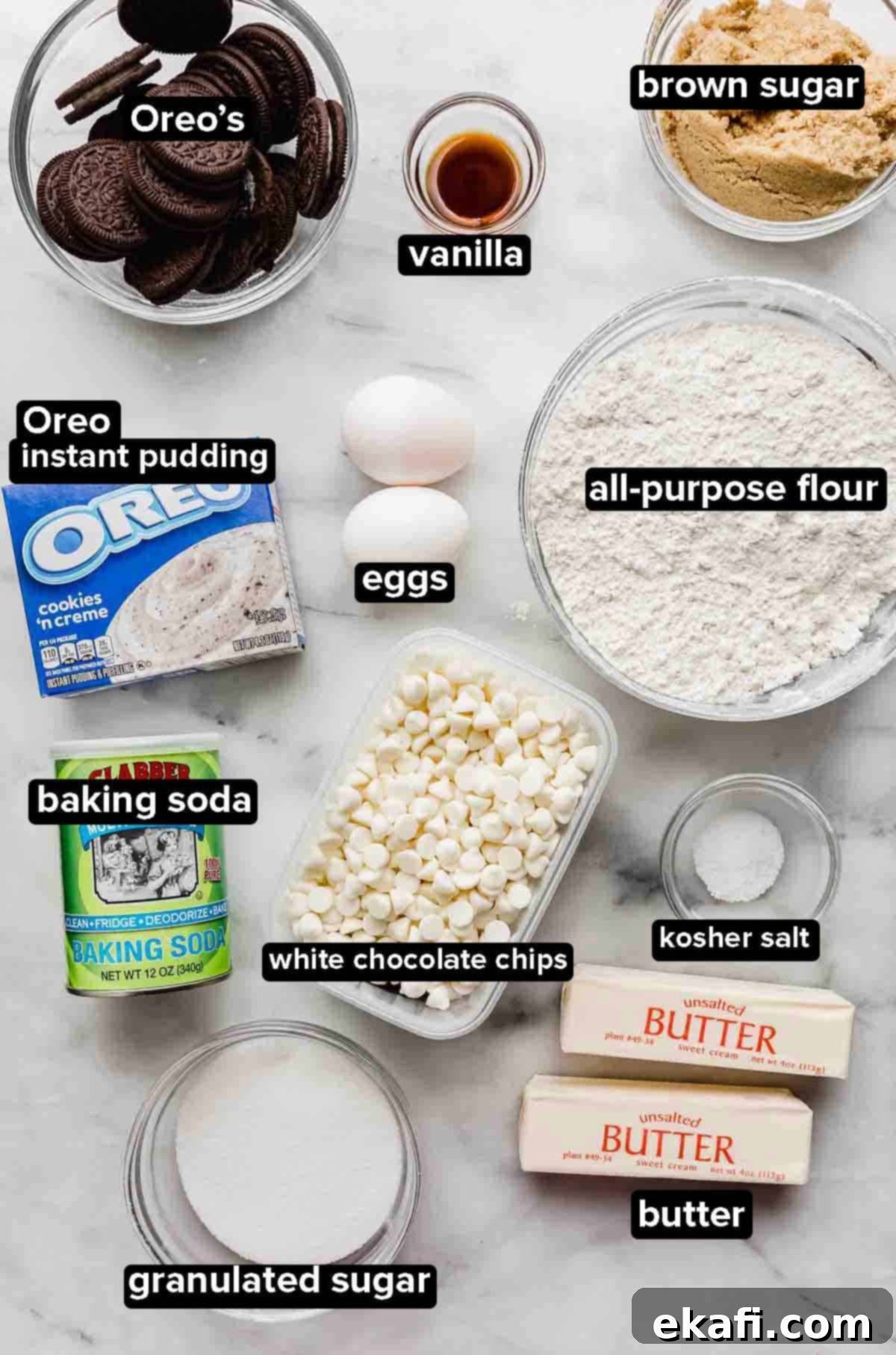Cookies and Cream Cookies 3 Cookies and Cream Cookies ingredients on a white background: Oreos, oreo pudding, flour, butter, white chocolate chips, eggs, sugar, and leavening agents.