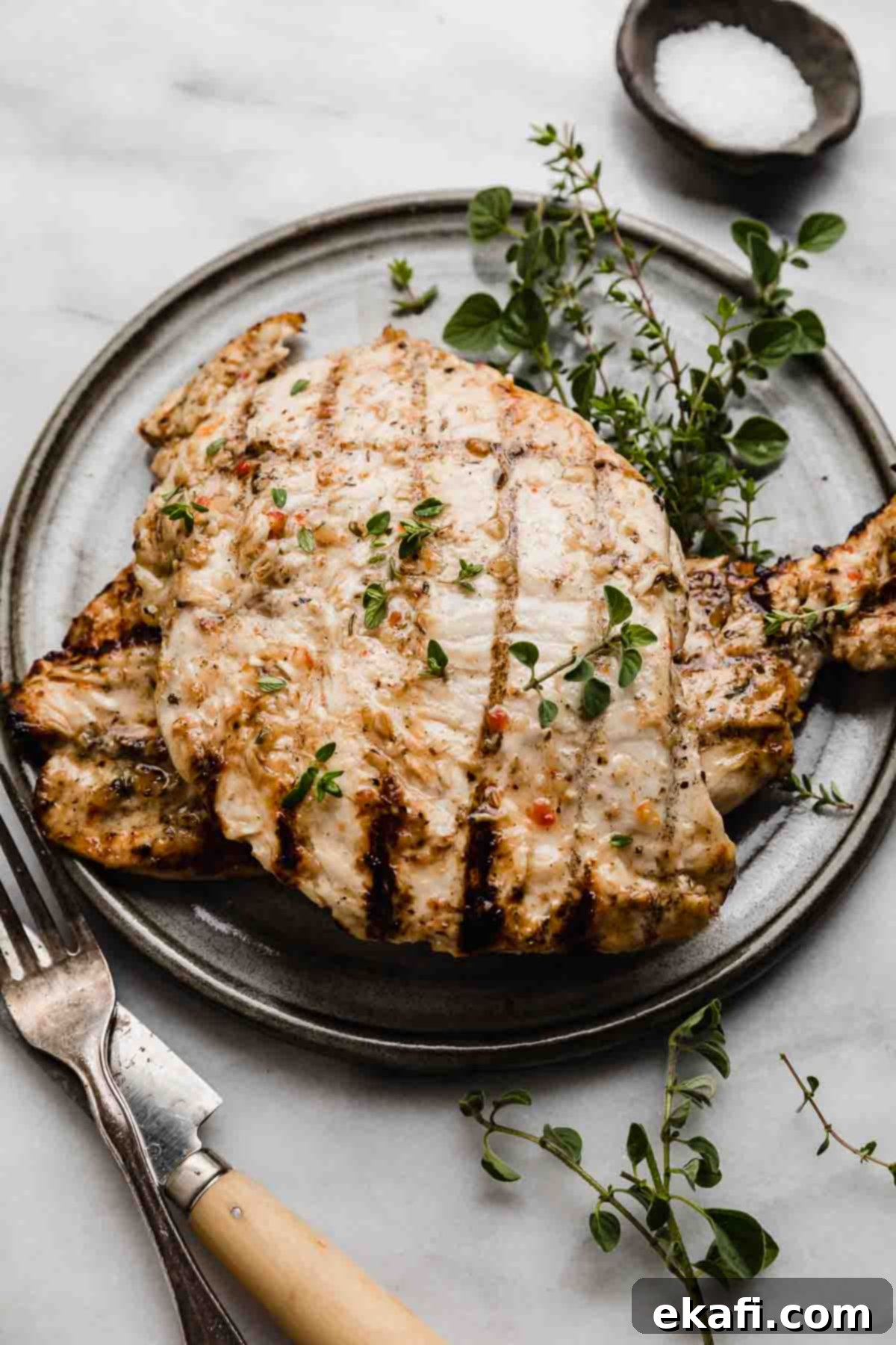 Zesty Italian Grilled Chicken 5 Italian Grilled Chicken on a gray plate.